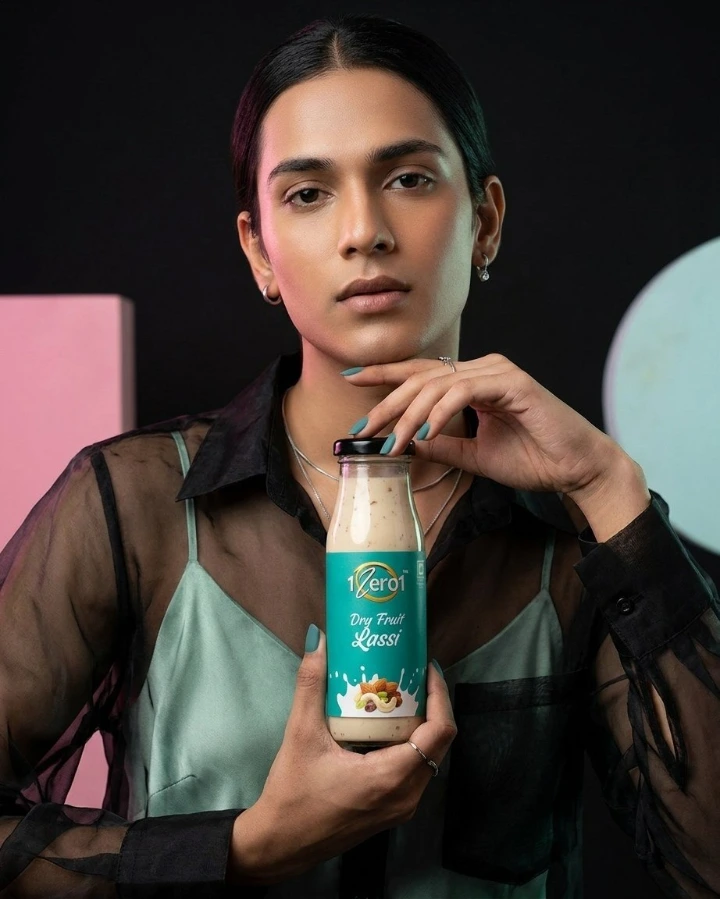 Man holding 1Zero1 flavoured lassi bottle